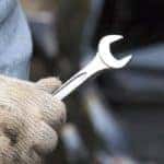 car technician holding the wrench