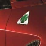 Closeup of a red 2018 Alfa Romeo Giulia Quadrifoglio with green four-leaf clover