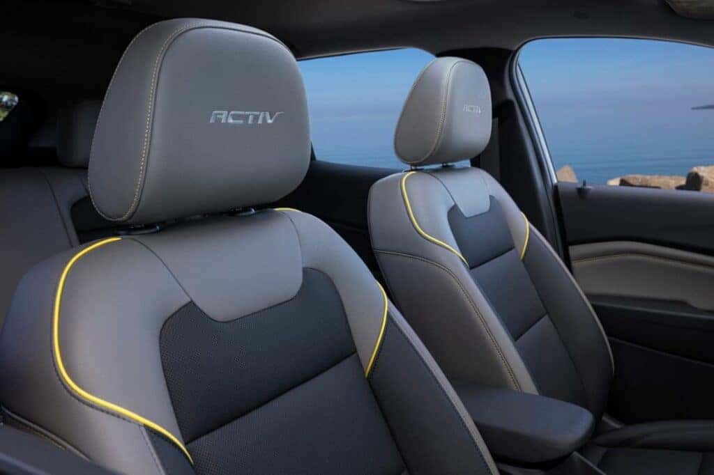 View of headrests in front cabin of Chevrolet Trax ACTIV with Jet Black with Artemis Accents Interior. Pre-production model shown. Actual production model may vary. Available in spring 2023. Cacti Green exterior color late availability.