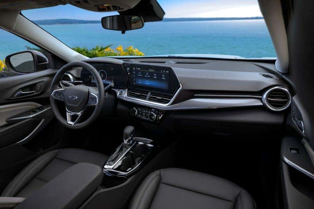 Passenger’s side view of front cabin in Chevrolet Trax ACTIV with Jet Black with Artemis Accents Interior. Pre-production model shown. Actual production model may vary. Available in spring 2023. Cacti Green exterior color late availability.
