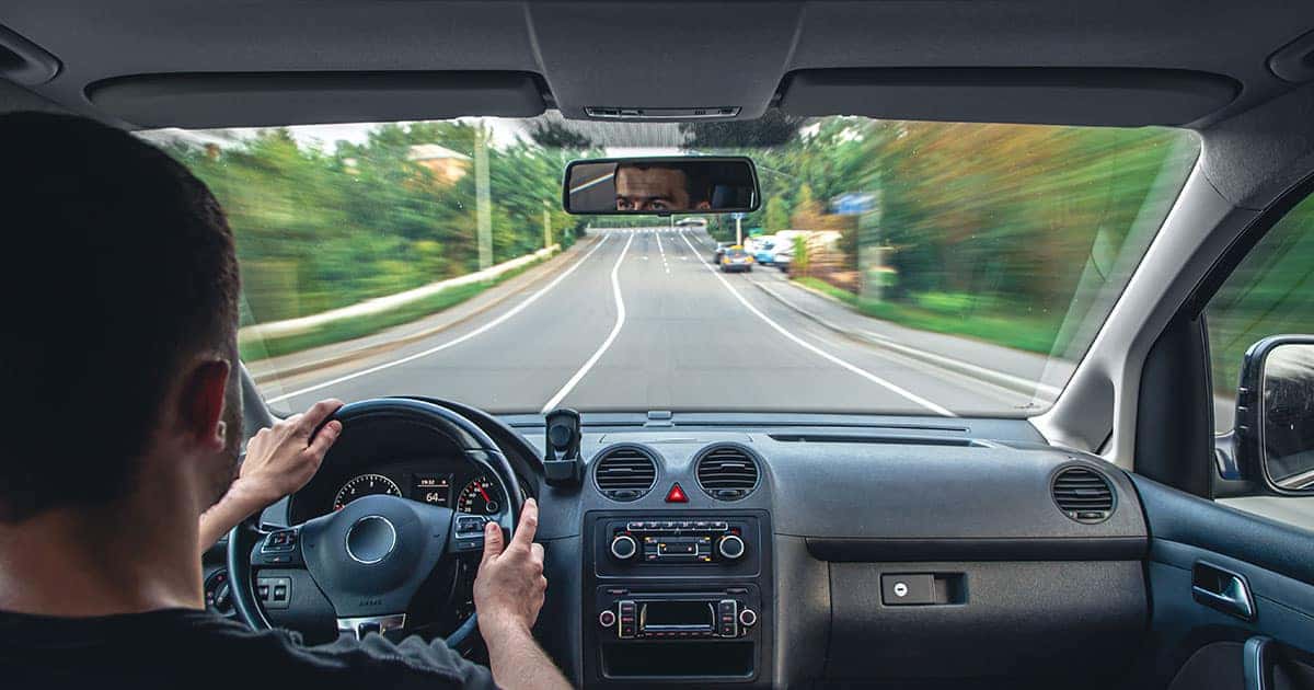 man driving on the road