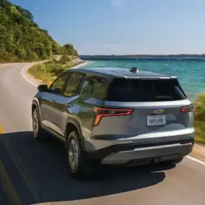 2026 Chevrolet Equinox LT Sterling Gray Metallic driving on a road
