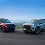 Red and Silver Chevrolet Traverse parked off road on a mountain