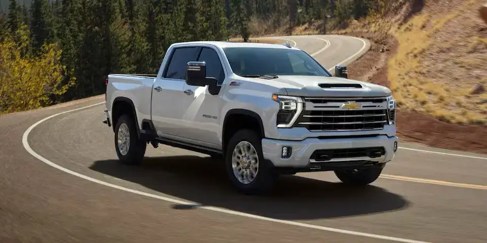 Chevrolet Silverado 2500 HD driving on a winding road