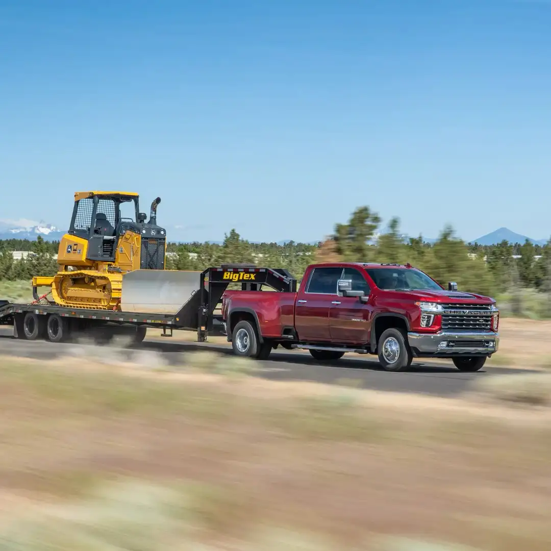 Chevrolet Silverado 3500HD towing heavy equipment