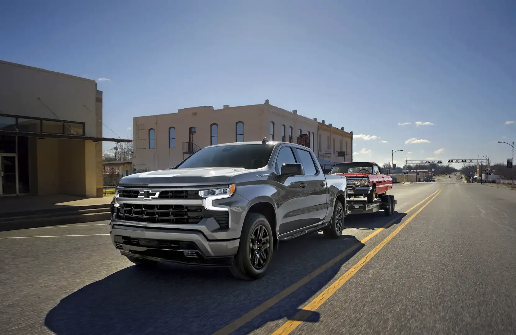 2026 Chevrolet Silverado 1500 towing a classic car