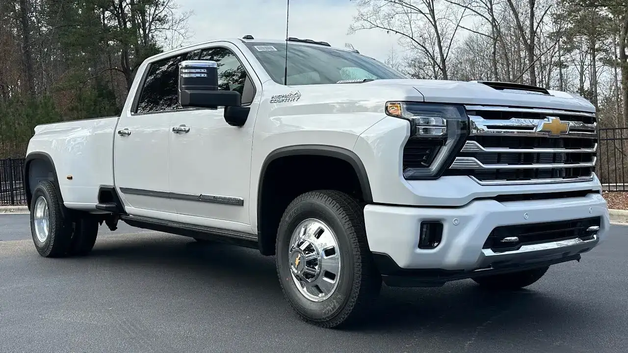 White Chevrolet Silverado 3500HD High Country parked on the road