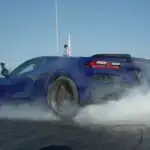 Corvette ZR1X on a drag race track generating smoke