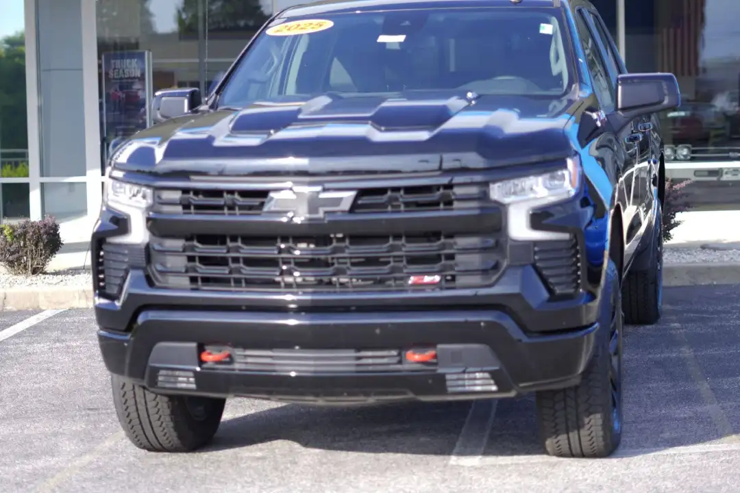 Front view of a dark metallic black 2025 Chevrolet Silverado Custom Trail Boss truck at Barry's Chevrolet in West Union, OH
