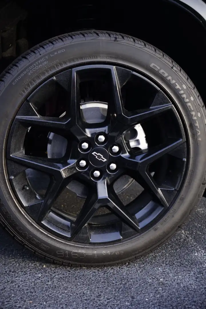 Close-up view of a black Chevrolet wheel rim and Continental tire at Barry's Chevrolet in West Union, OH