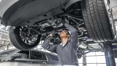 Chevrolet mechanic working on car