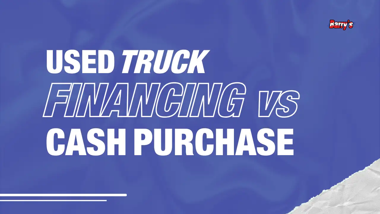Used truck on Barry's lot or a buyer reviewing paperwork