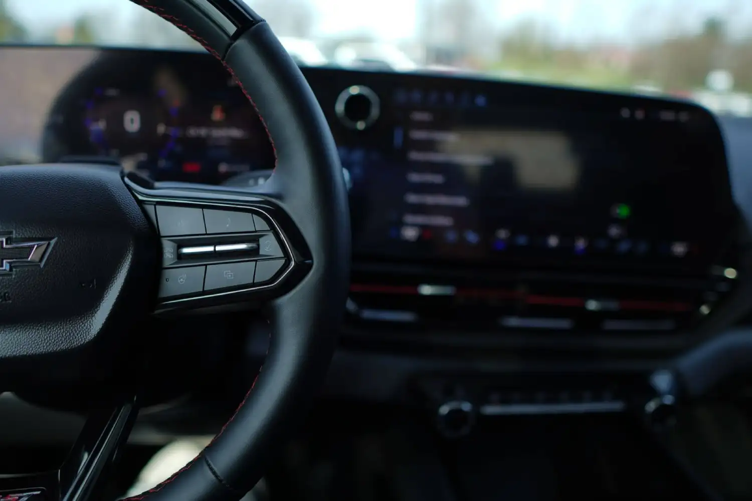 Close-up of a Chevrolet steering wheel showing integrated control buttons