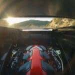 Glorious Sunlight Shines Through The Chevy Corvette's Open Hood, At The Evolved V8 Engine
