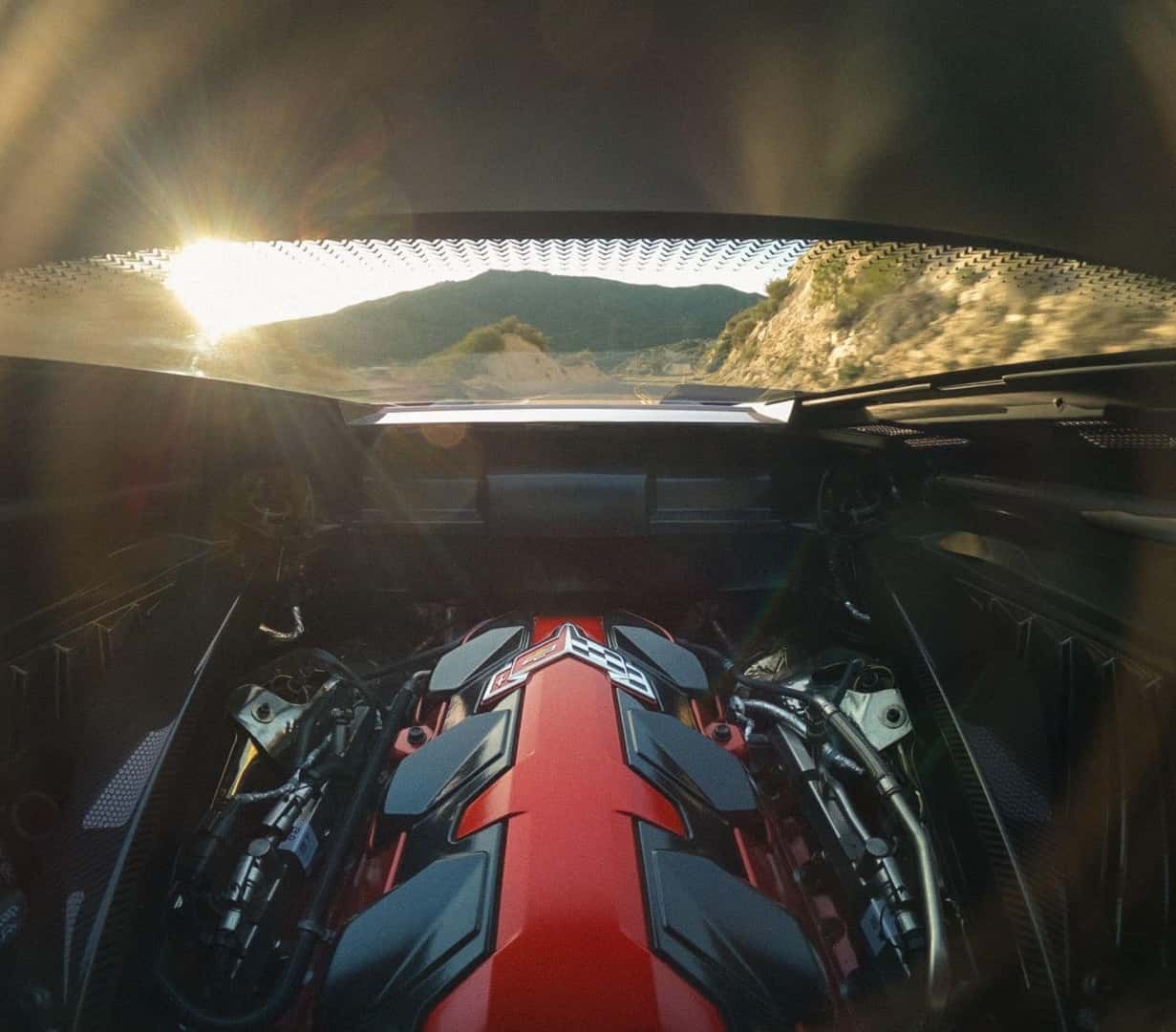 Glorious Sunlight Shines Through The Chevy Corvette's Open Hood, At The Evolved V8 Engine