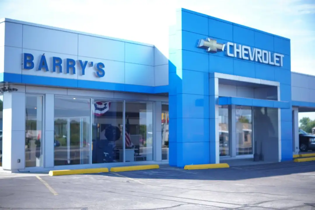 Exterior view of Barry's Chevrolet dealership showroom building with its signature blue facade in West Union, Ohio