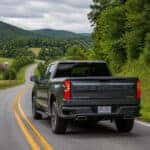 2026 Chevrolet Silverado 1500 on a winding two-lane Adams County Ohio highway heading toward West Union in late summer