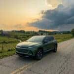 2026 Chevrolet Equinox on a rural Adams County Ohio two-lane road with summer storm clouds building