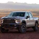 2027 Chevrolet Silverado 1500 on a hilly rural road in fall