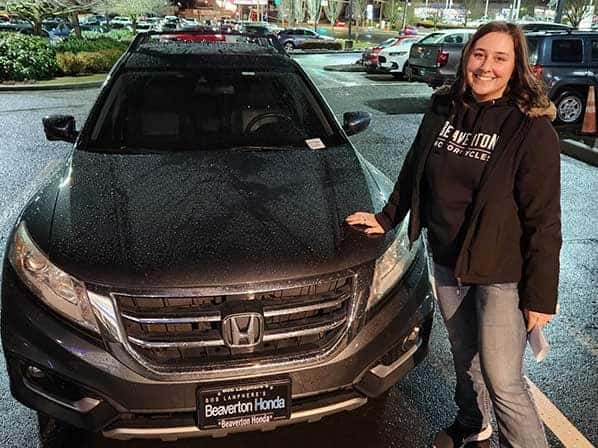 lady next to a car