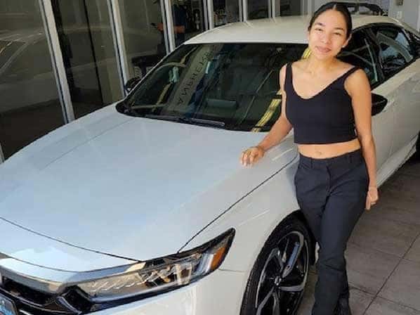 Girl next to a car