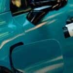 A close-up of a charger plugged into a teal 2026 Honda Prologue EV
