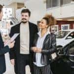 A couple trading in their car at a dealership