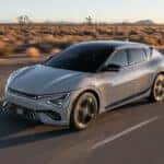 A gray 2025 Kia EV6 driving through the desert