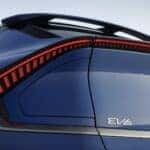A close-up of the back of a blue 2025 Kia EV6