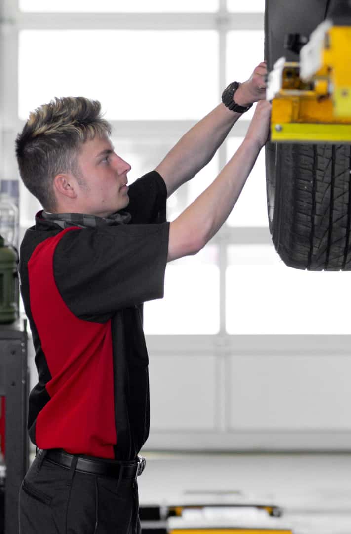 Beaver Toyota service technician working on a tire