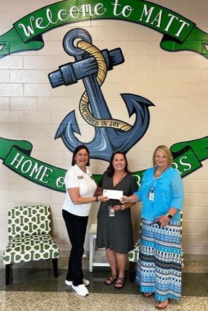 Beaver Toyota of Cumming presenting a check to a school as a thank you to a teacher who purchased a car