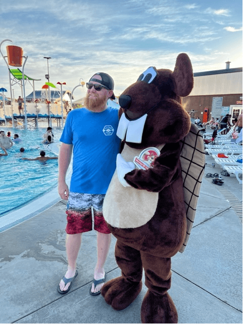 Bucky the Beaver Mascot and a customer