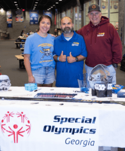 people in front of Special Olympics sign