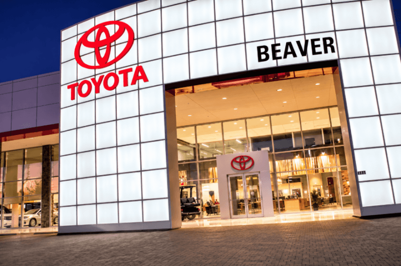 Beaver Toyota dealership exterior illuminated at night in Cumming, GA
