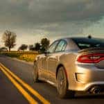 2018 Dodge Charger driving on a country road banner