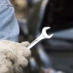 car technician holding the wrench