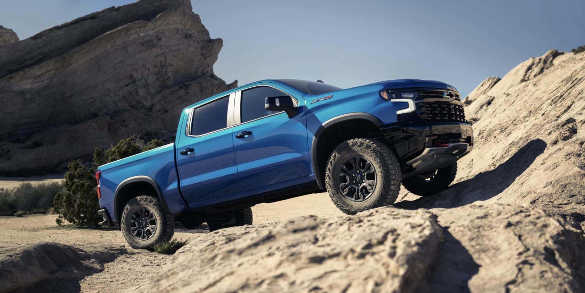 Blue 2026 Chevy Silverado 1500 on rocky terrain in Grove City, OH