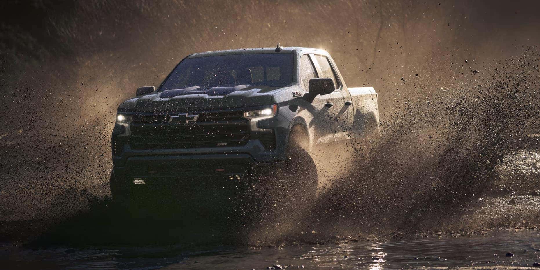 New 2026 Chevy Silverado 1500 driving through mud near Columbus, OH