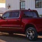 Red Ram 1500 parked by country home at sunset