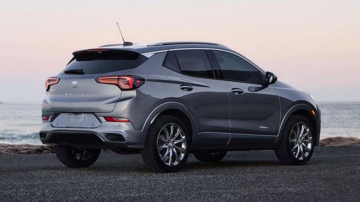 A gray 2026 Buick Encore SUV parked near the water at sunset