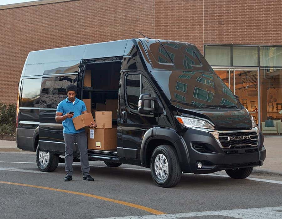 delivery driver getting package out of van