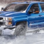 Chevrolet Silverado driving in snow