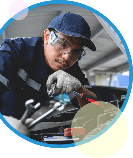 Image of a person fixing an engine