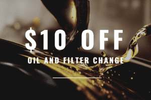 This is a photograph of gold yellow liquid, what is supposed to look like motor oil. It is a close up image of the motor oil in motion. ON top of the image it says "$10 off oil and filter change" in white lettering. 