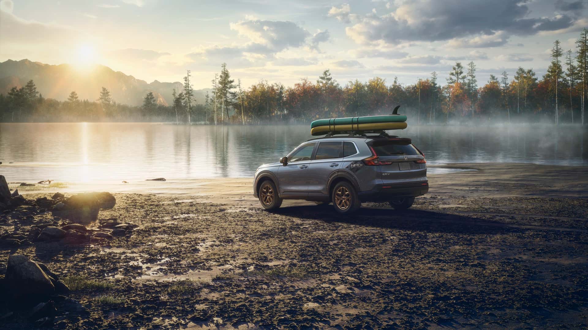 Gray Honda CR-V EX AWD parked beside a lake