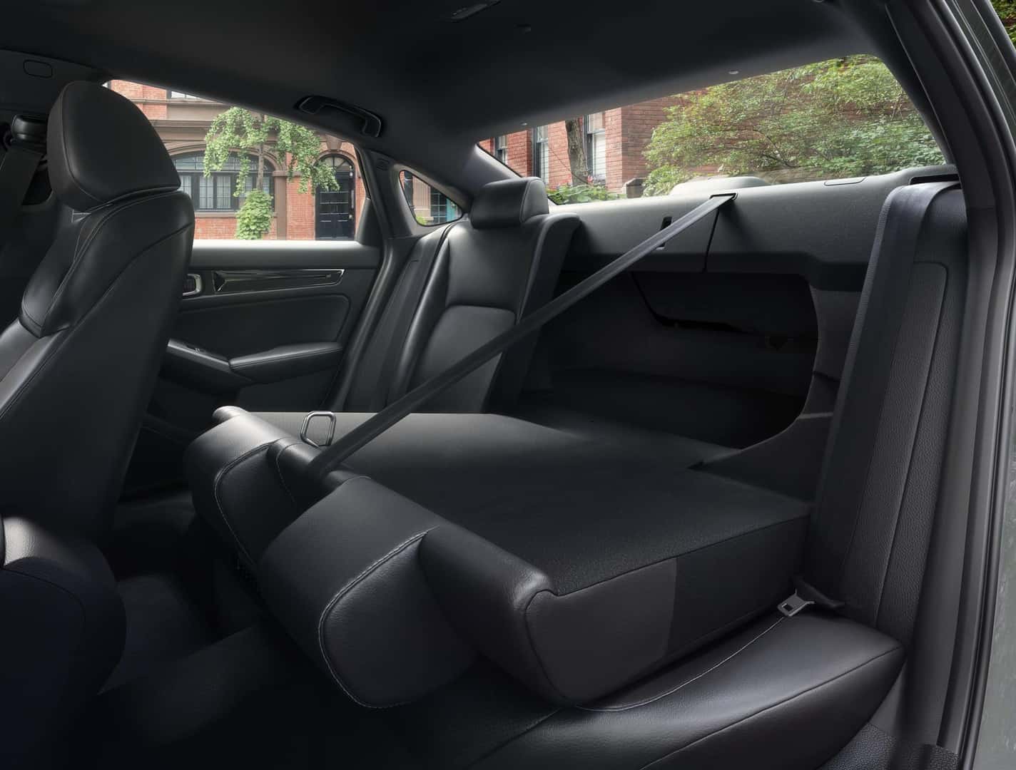 Honda Civic Sedan Sport Touring Hybrid with one side of the 60/40 rear seat folded for access to the trunk