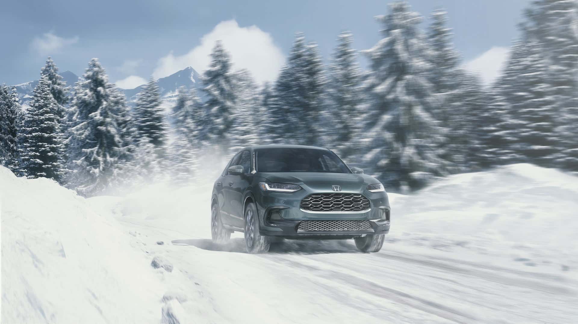 Honda HR-V EX-L AWD traveling on a snow-covered road