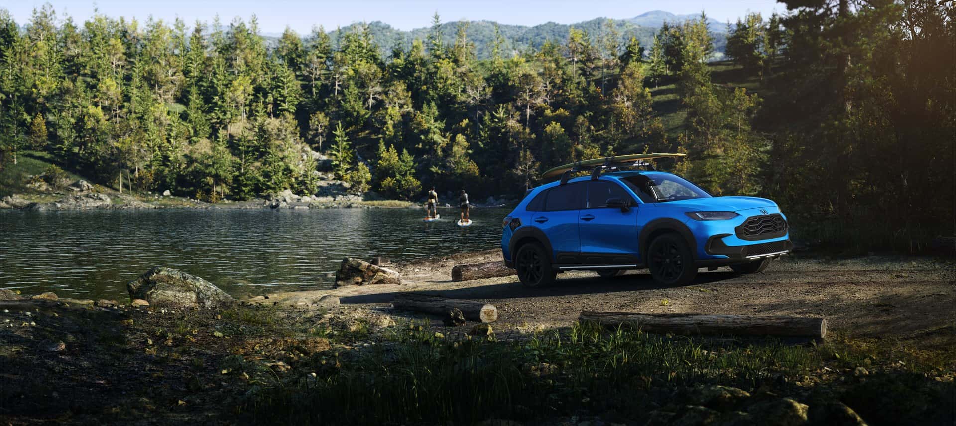 Blue Honda HR-V Sport parked beside a lake