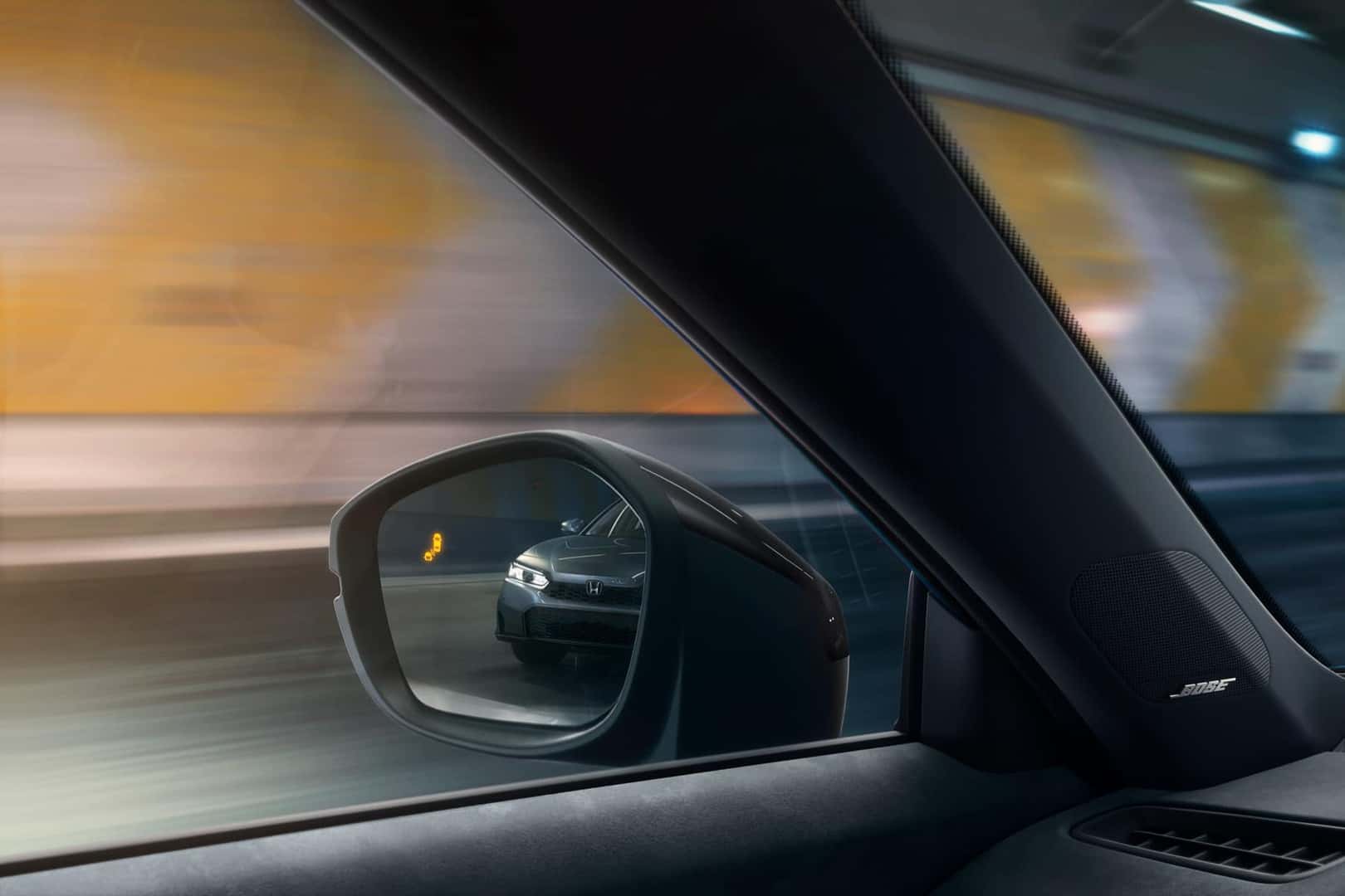Illuminated Blind Spot Information System indicator in a 2027 Honda Civic Type R side mirror