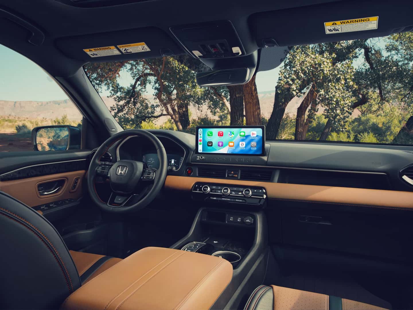 2027 Honda Passport dashboard displaying the Apple CarPlay screen
